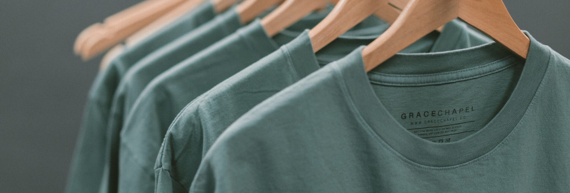 Green t shirts on hangers